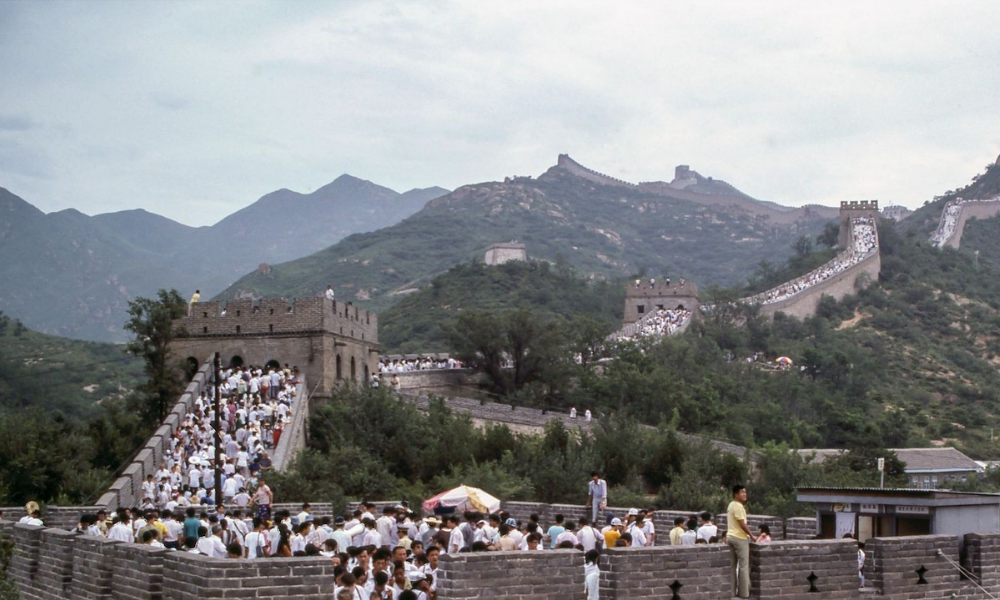 tourists dressed in white crowded on Great Wall of China