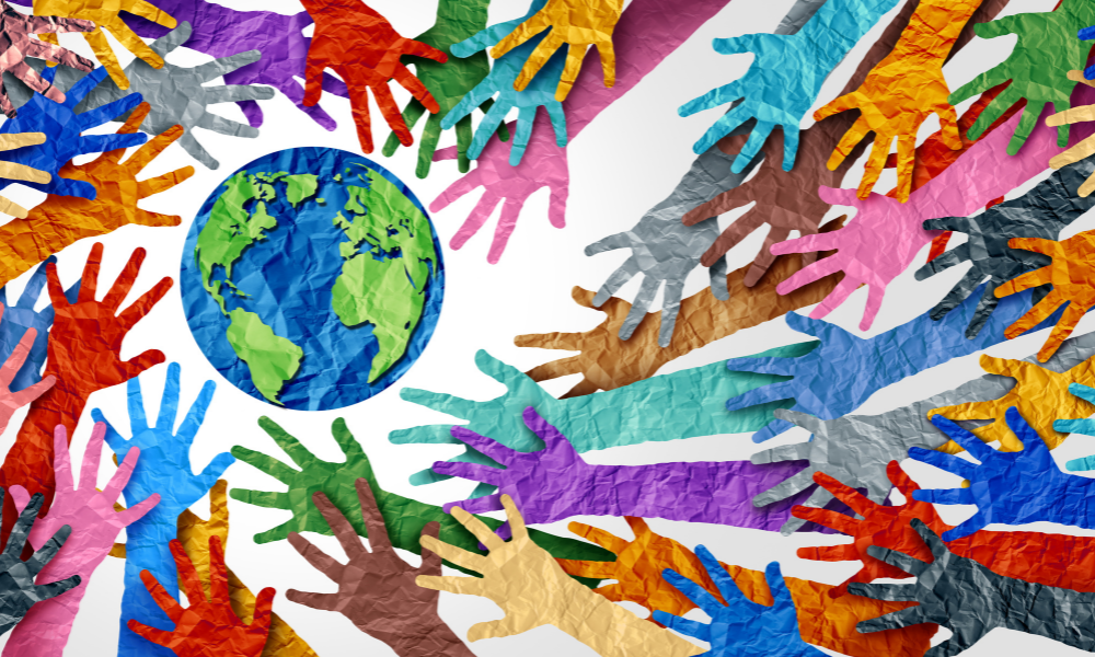 World diversity and international culture as a concept of diversity and crowd cooperation symbol as diverse hands holding together the planet earth.