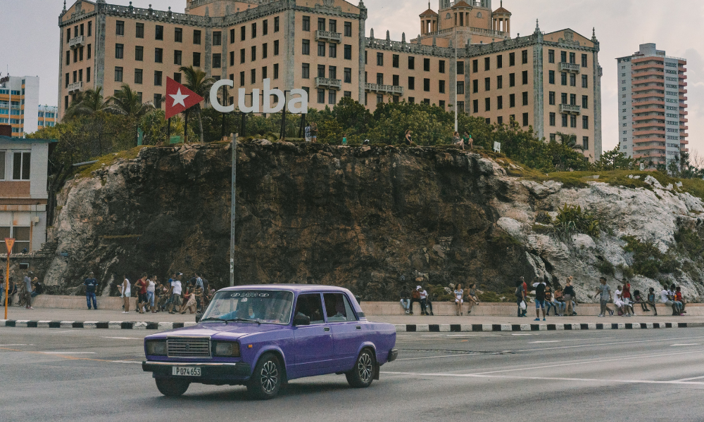 A classic car in front of the Hotel Nacional in Havana, Cuba